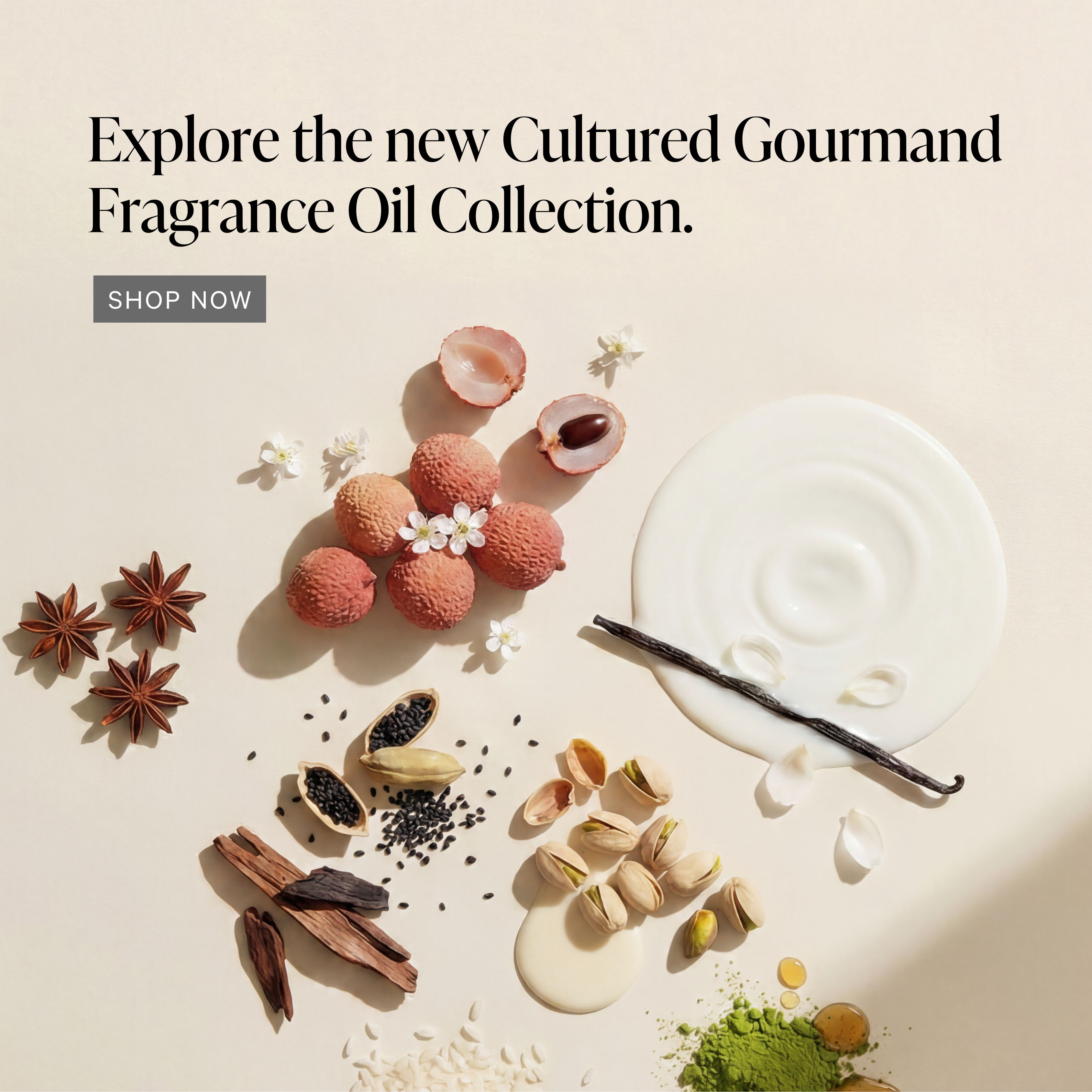 Artistic arrangement of ingredients for a fragrance oil collection advertisement.