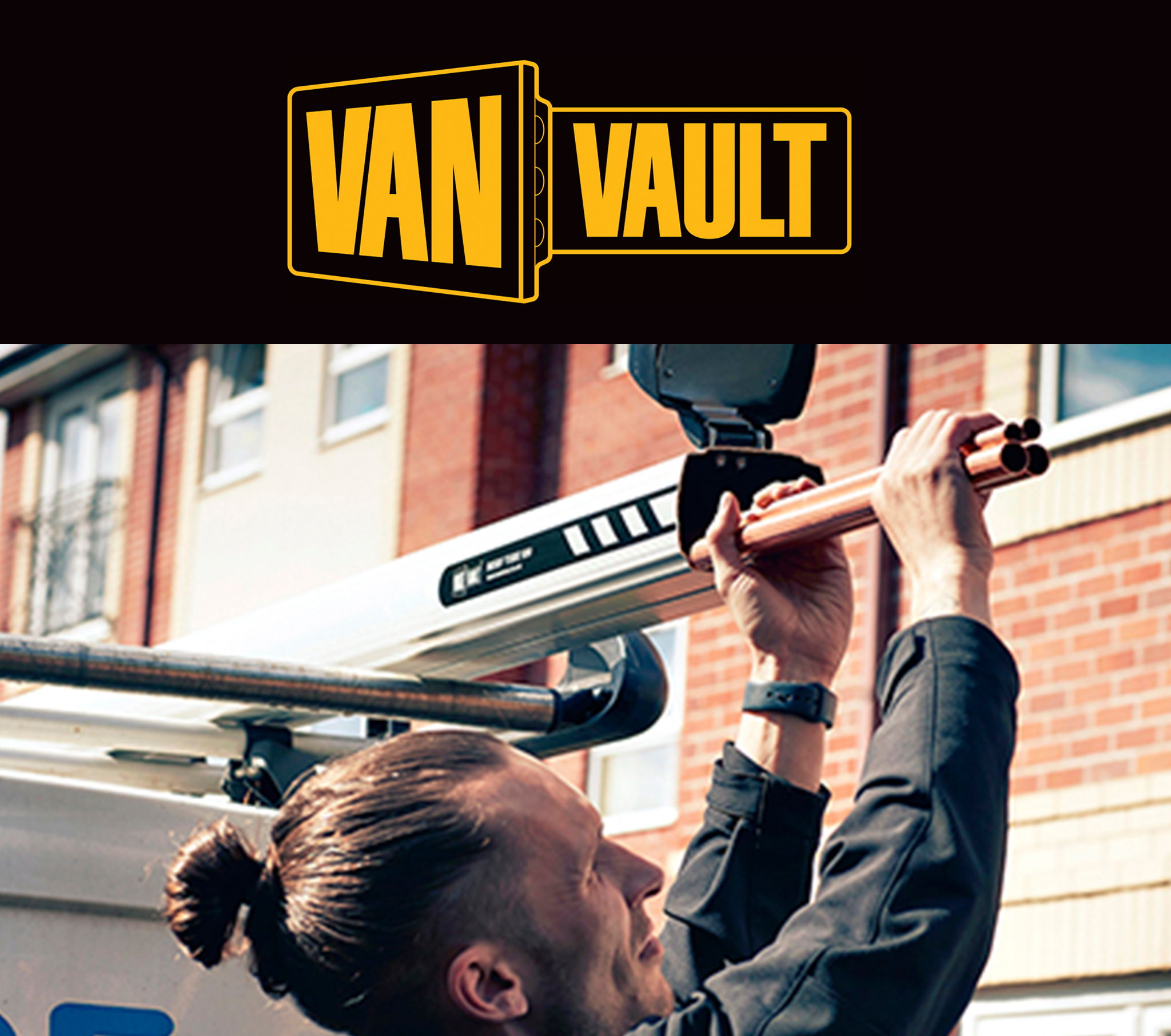 Person adjusting equipment on a van with the Van Vault logo above.