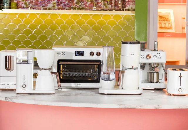 A collection of Cafe Matte White countertop appliances in a kitchen