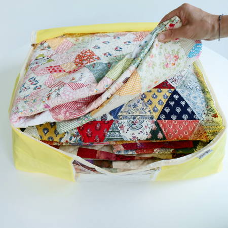 quilts stored in a quilt storage bag 