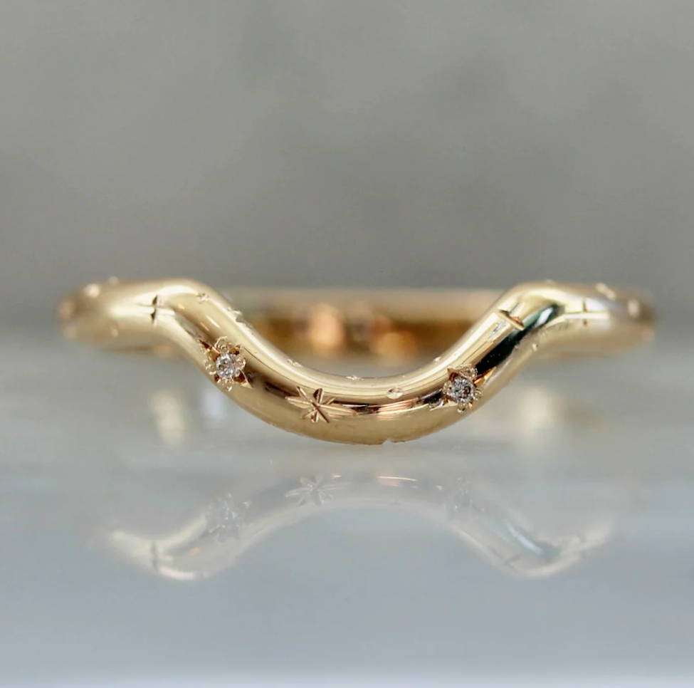 curved-gold-diamond-band-with-star-engraving