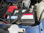 Engine bay Nissan battery red positive terminal cover wiring looms Jonathan's 2020 Nissan Titan Outlaw 228H train horn electrical gallery photo 3