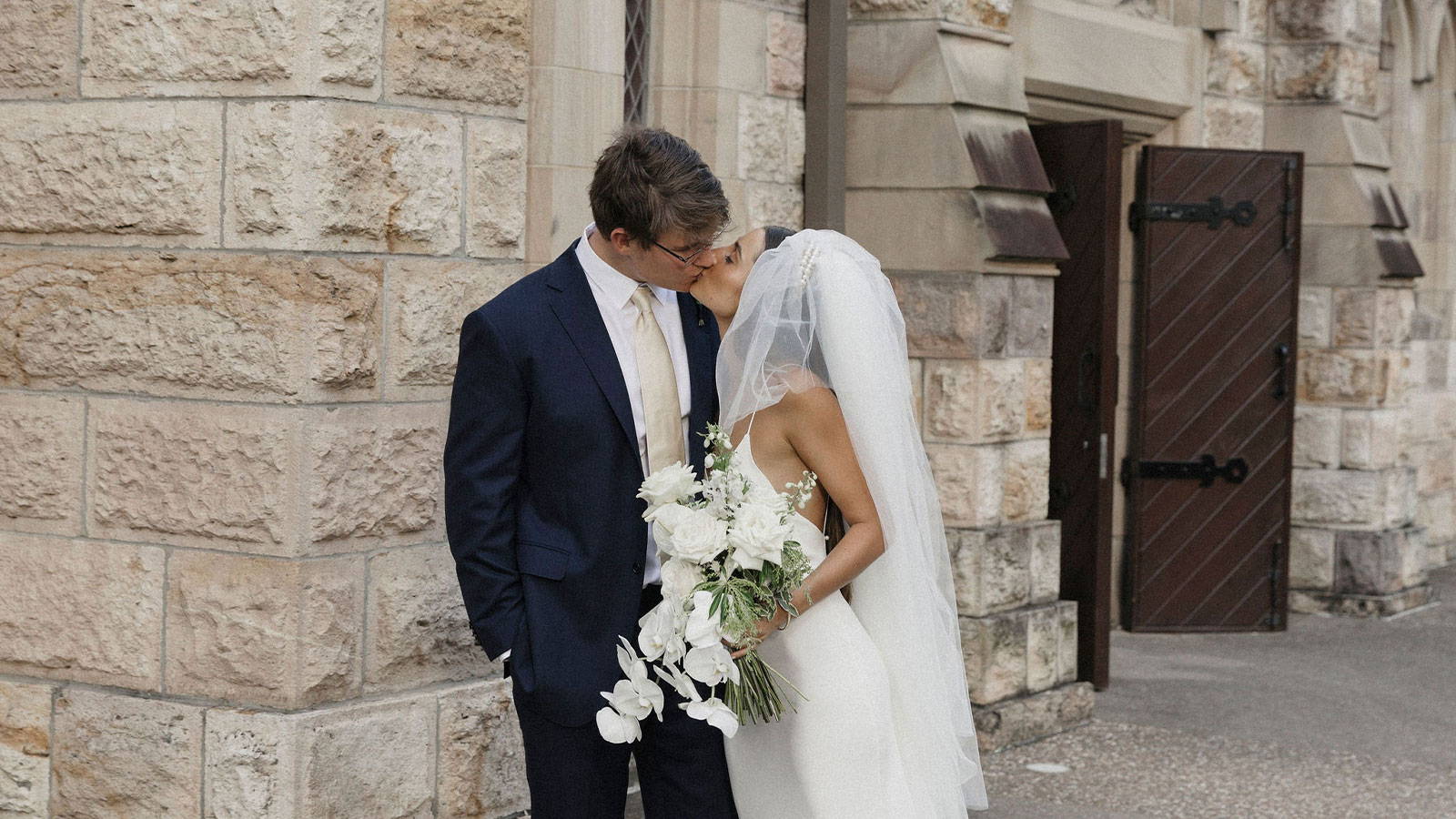 Bride and Groom sharing a kiss