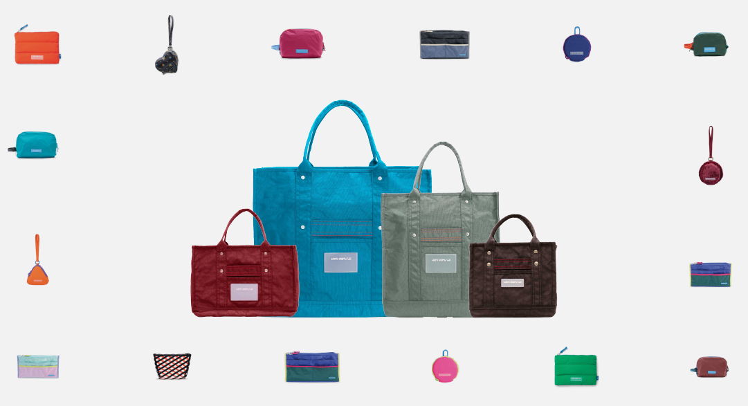 Colorful bags and wallets arranged on a light background.