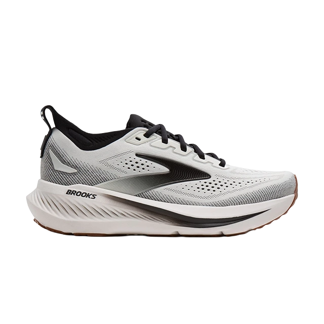 Side view of a grey and black running shoe.