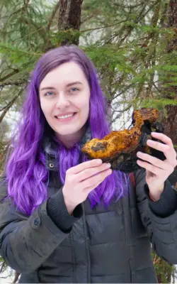 Kaitlin Lawless holding a conk of wild chaga