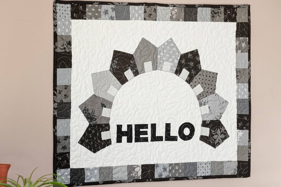 Hello wall hanging pattern using charm pack precuts