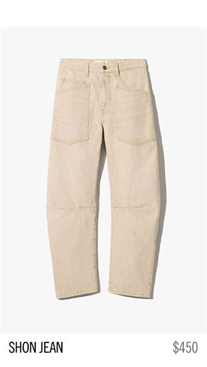 Beige Shon jeans displayed on a white background with a price tag.