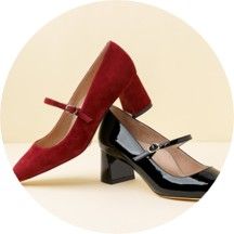 A pair of Mary Jane heels, one red and one black.