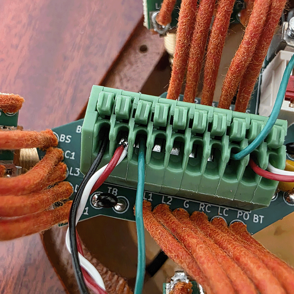Close-up of a circuit board with wires and connectors.