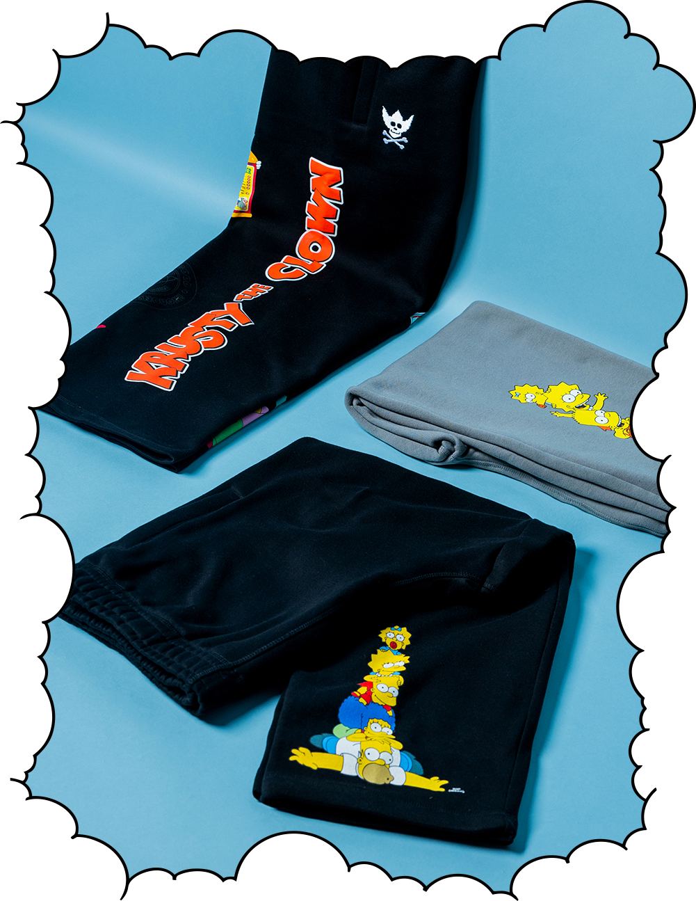 Black and gray pants with colorful cartoon graphics on a blue background.