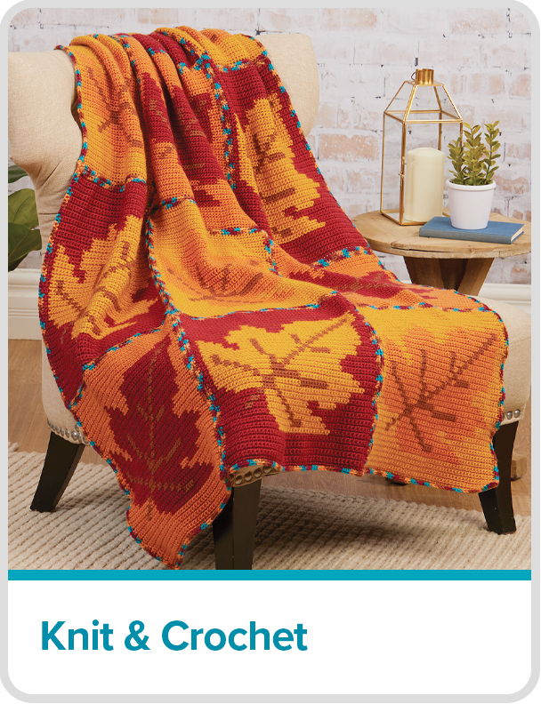 Fall leaves crocheted blanket draped over a chair - Knit & Crochet