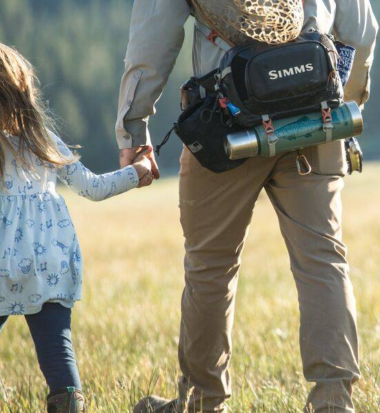 Father Holding Daughters Hand In The Outdoors