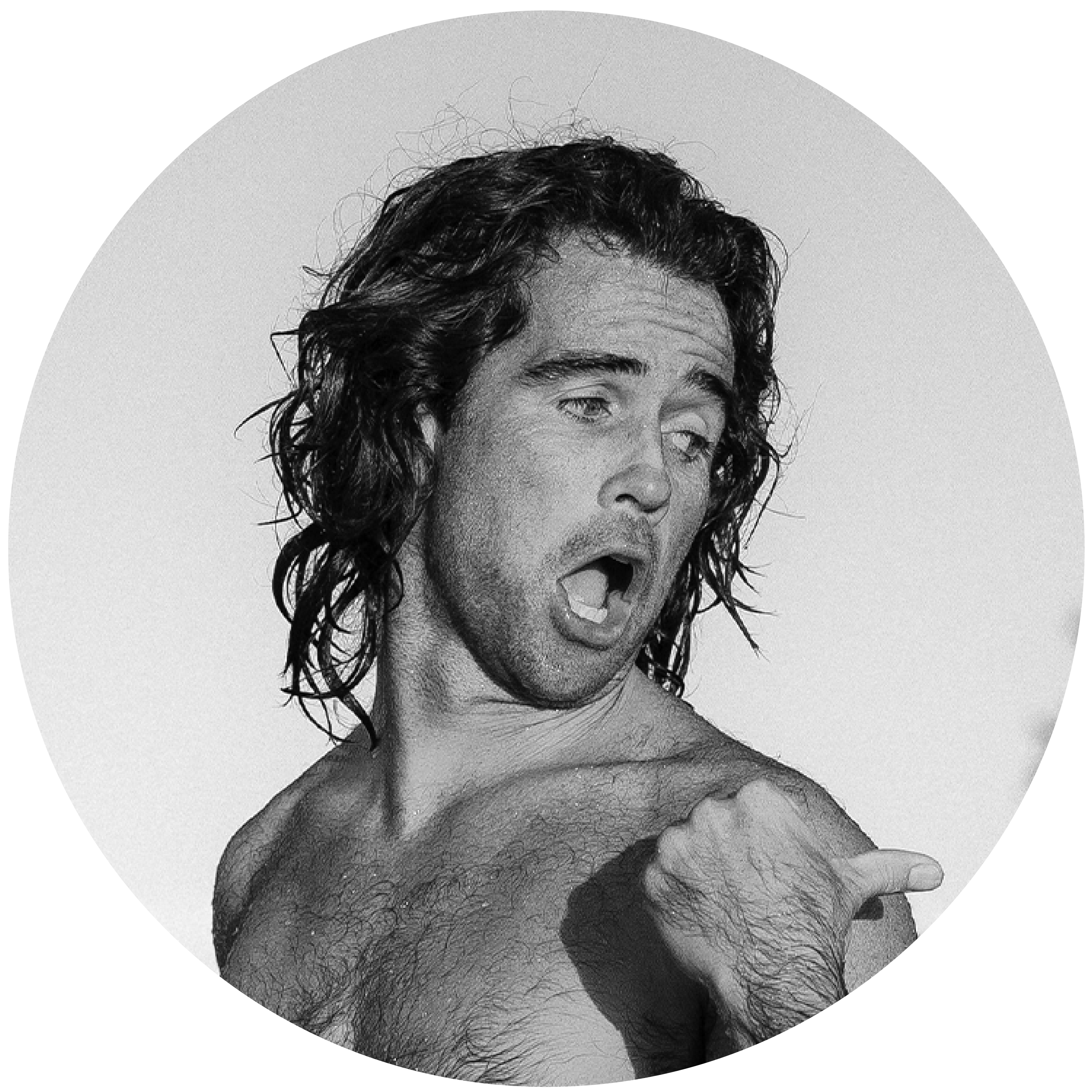 Person with long hair making a playful expression, circular black and white image.