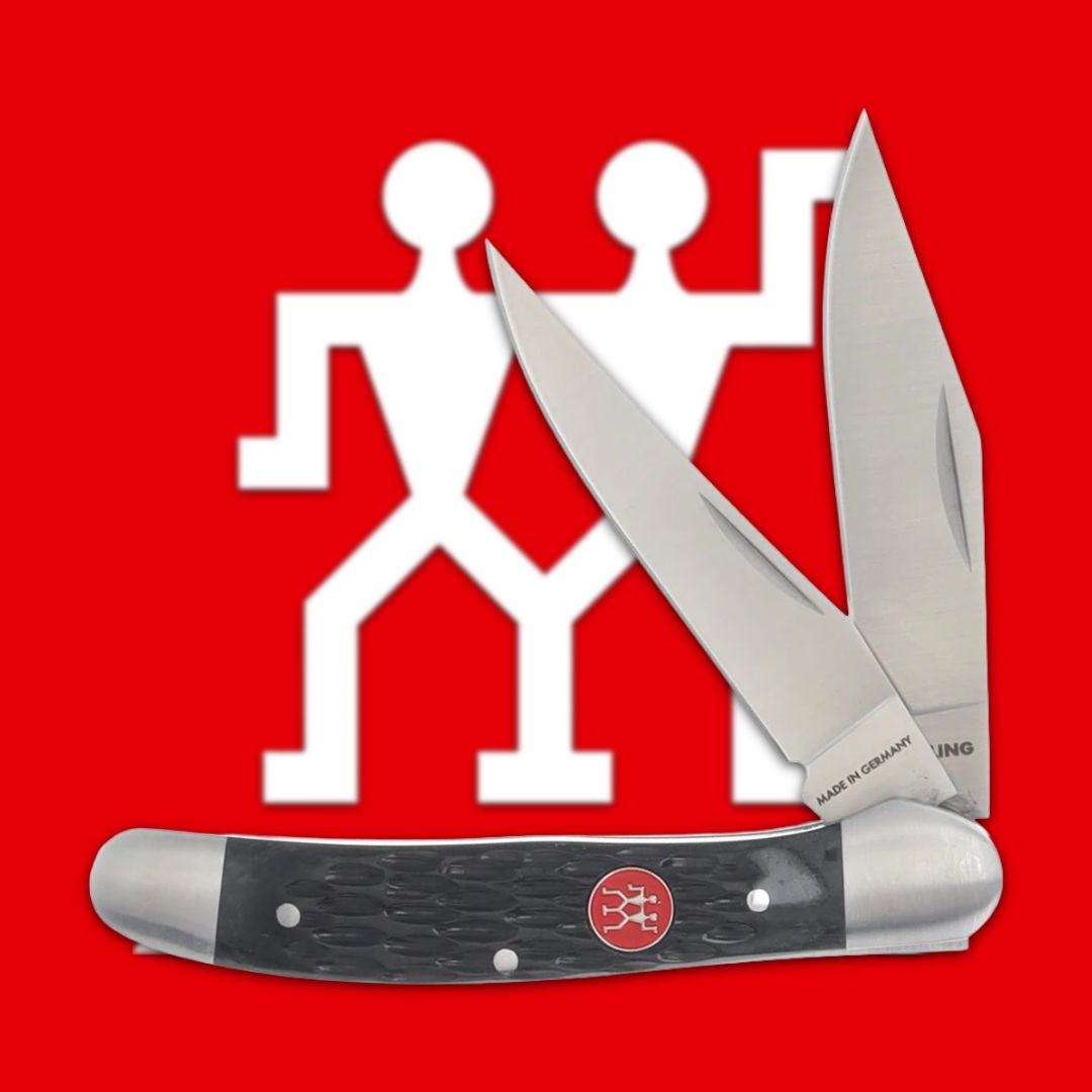 A pocket knife with dual blades on a red background.