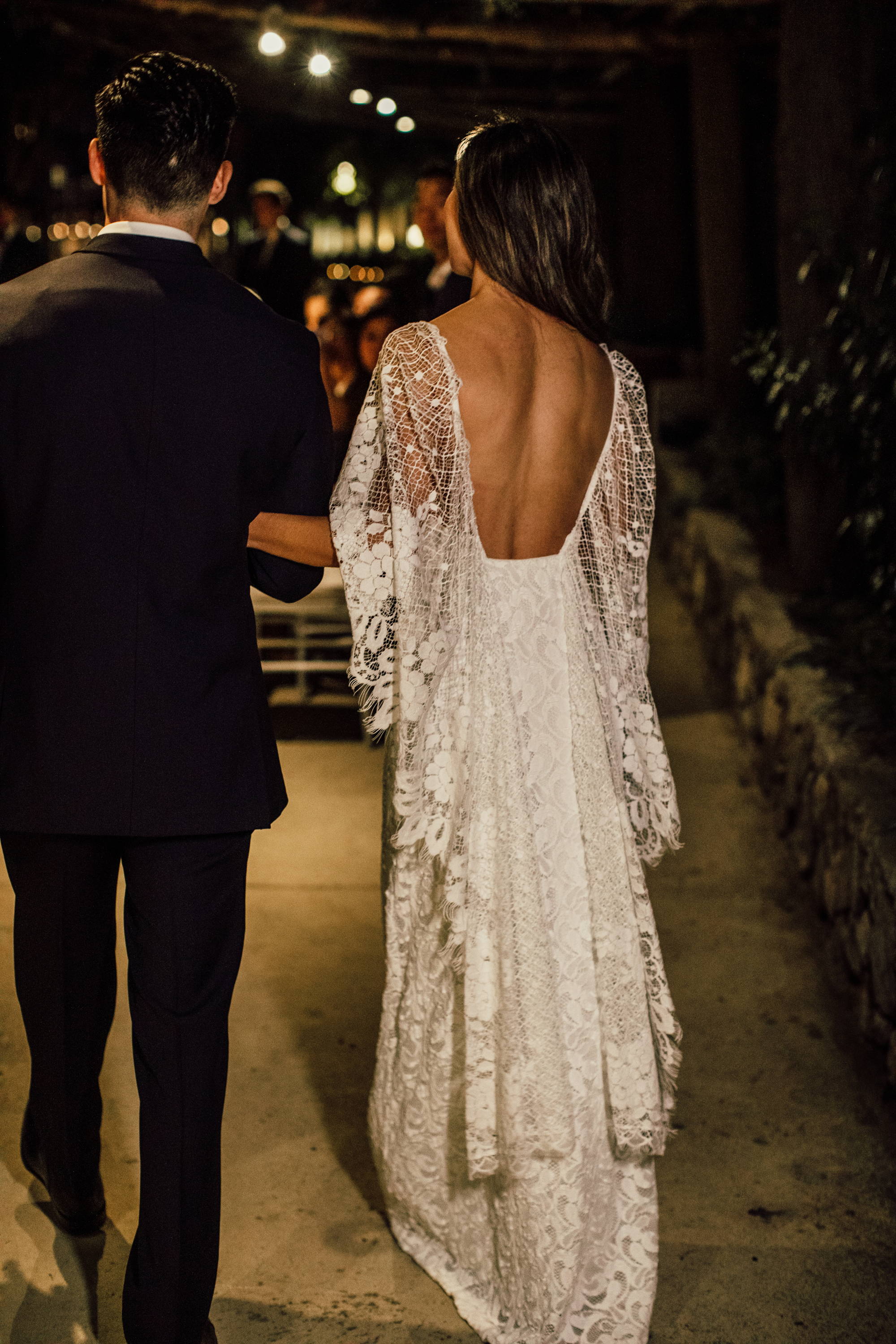 Bride wearing a low back french lace dress