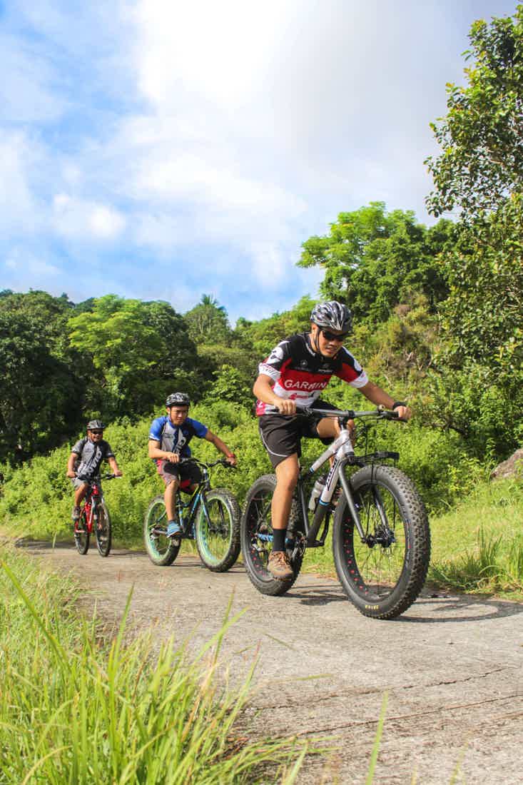 three men on bicycles