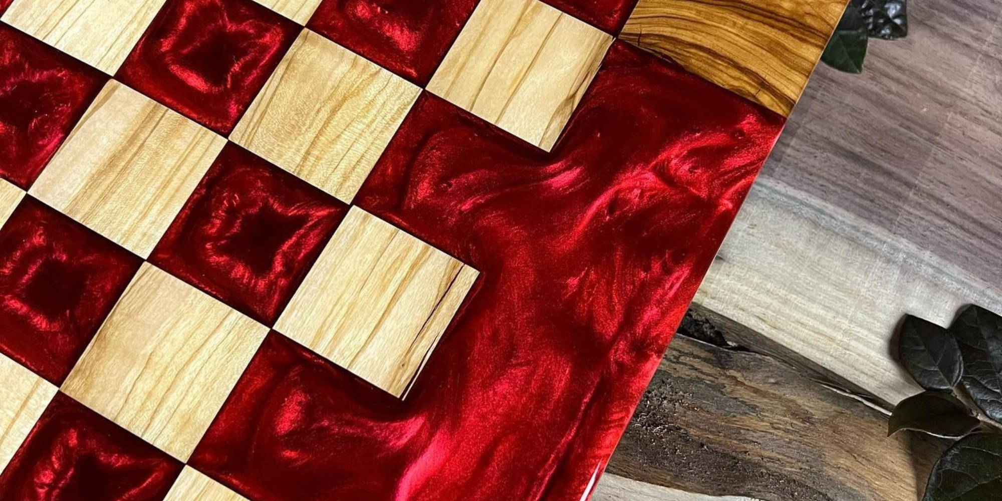 custom chess table in bright red from southern river tables sitting on a wooden table