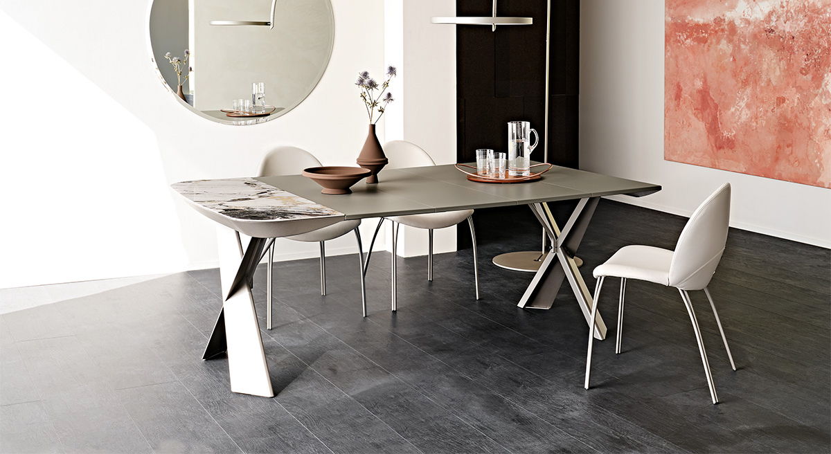 Modern Terminal Keramik Console and Dining table by Cattelan Italia, chairs, and abstract wall art.