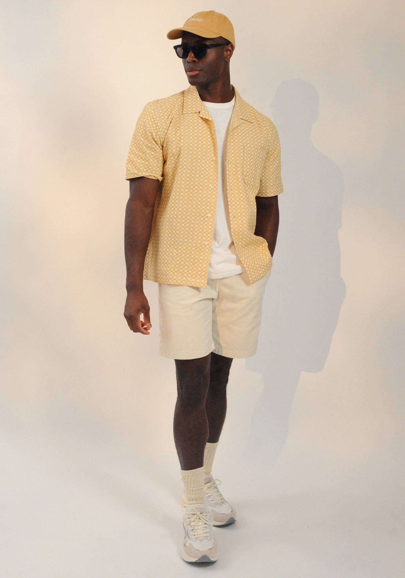 A model wearing a look from the SS24 Holiday Shop for Him campaign.
