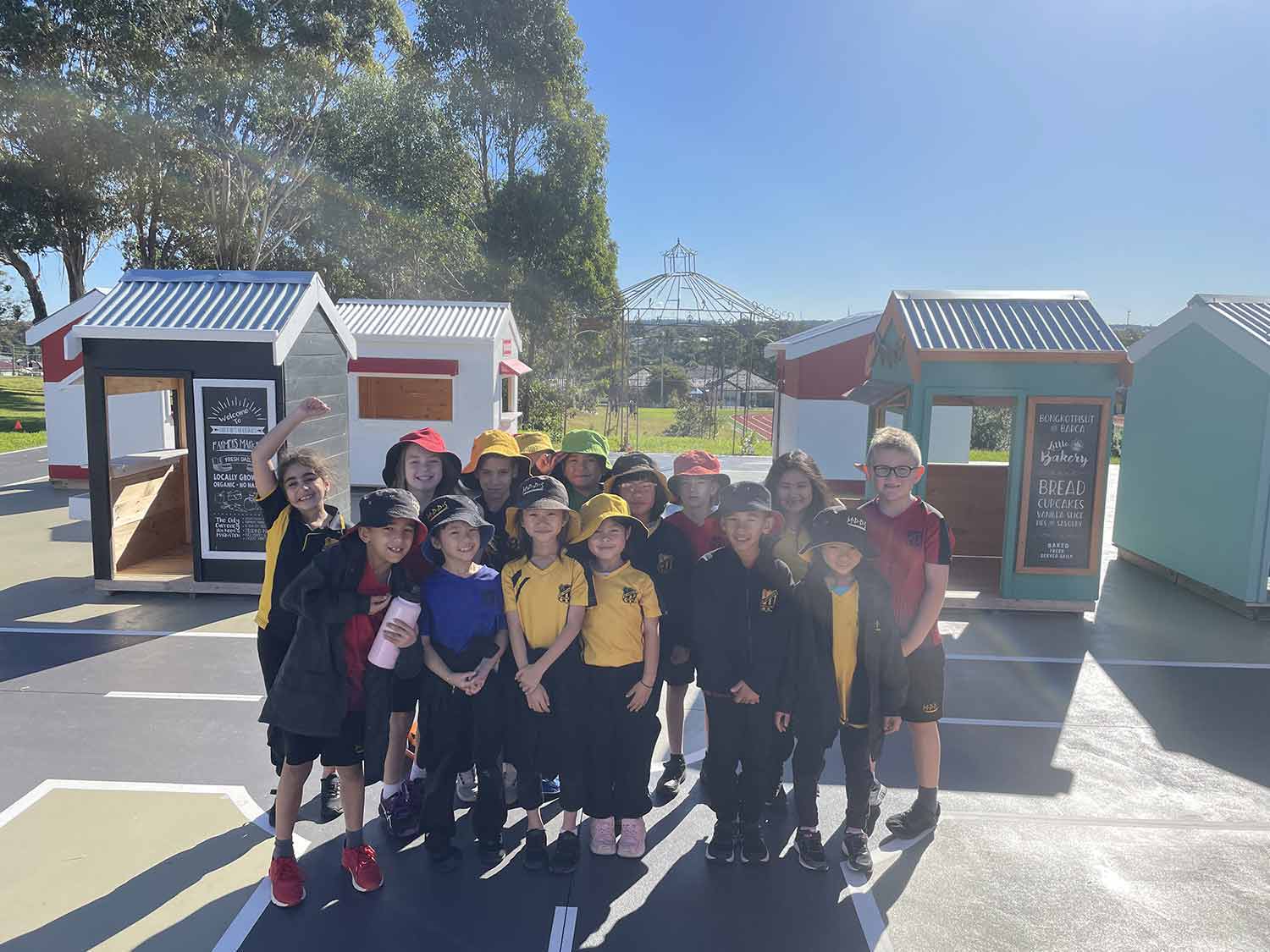 Kids from Mt Pritchard Primary School enjoying their wooden cubby house village. 