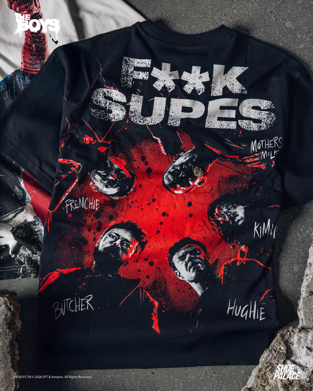 Black t-shirt with graphic design featuring faces and text 