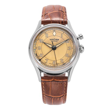 Vintage watch with a brown leather strap and yellow dial.