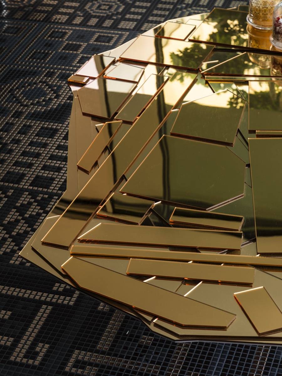 detail photo of a gold glass coffee table