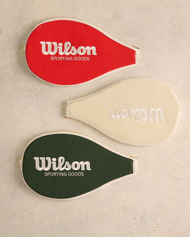 Three tennis racket covers in red, white, and green colors.
