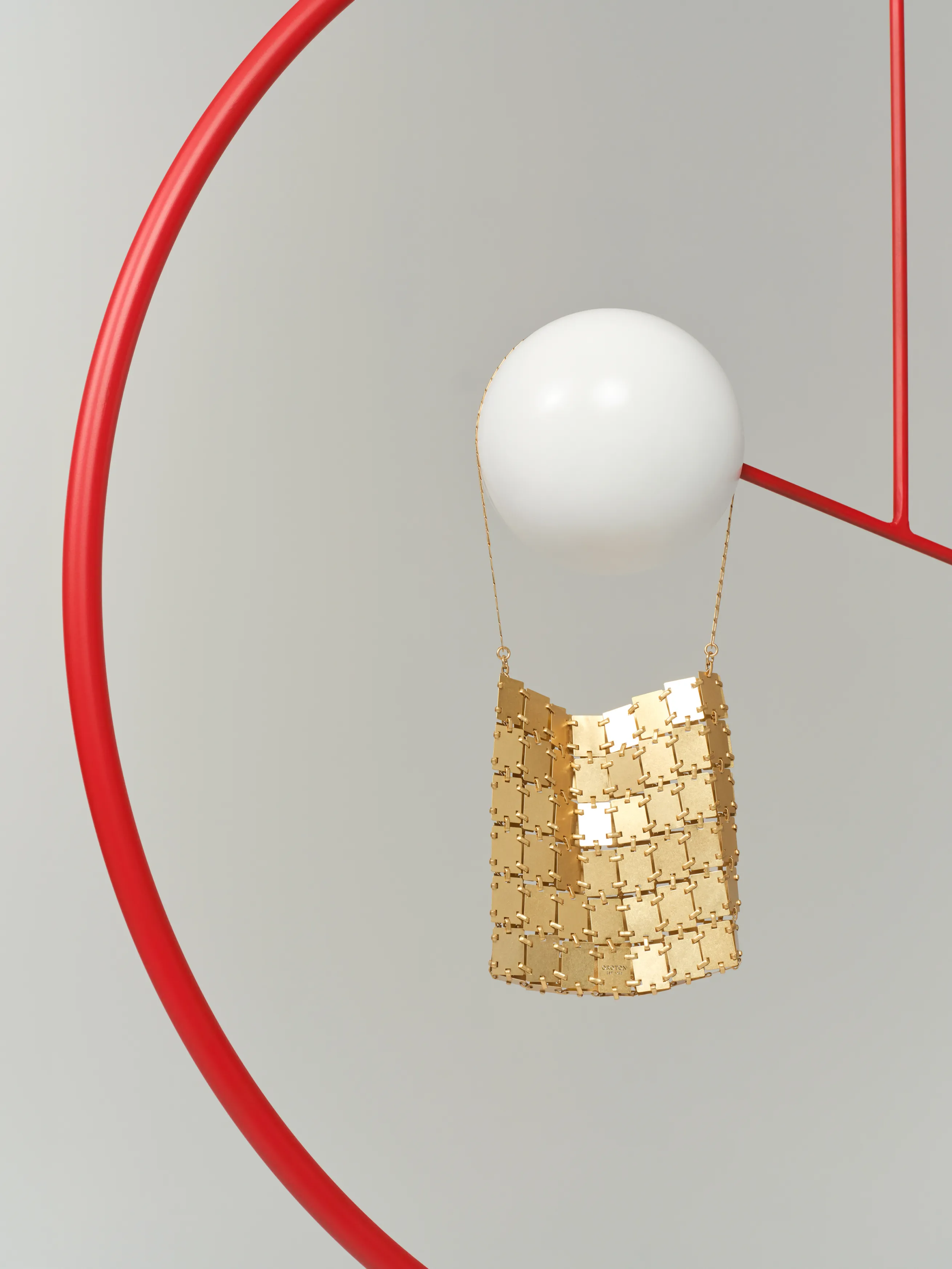 A modern lamp design featuring a white globe and gold accents.