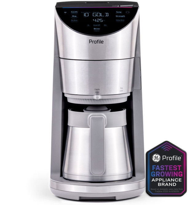 Coffee maker with digital display and a glass carafe.