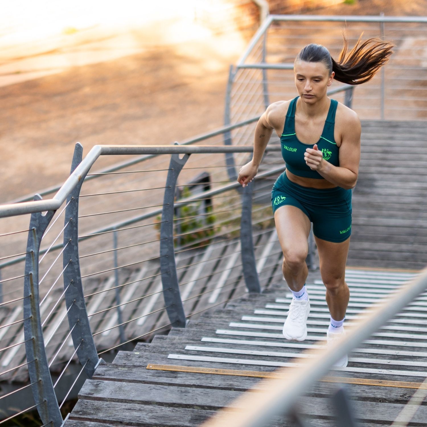 Runner ascending stairs in athletic gear, focused and determined.