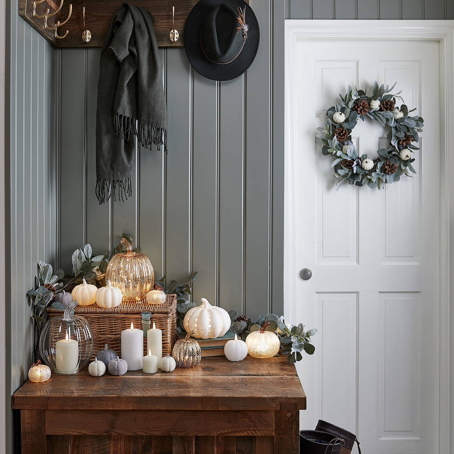 Autumnal entrance featuring seasonal product including wreaths, pumpkins and LED candles