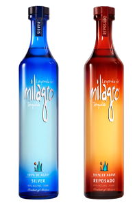 Two bottles of Milagro tequila, one silver and one reposado.