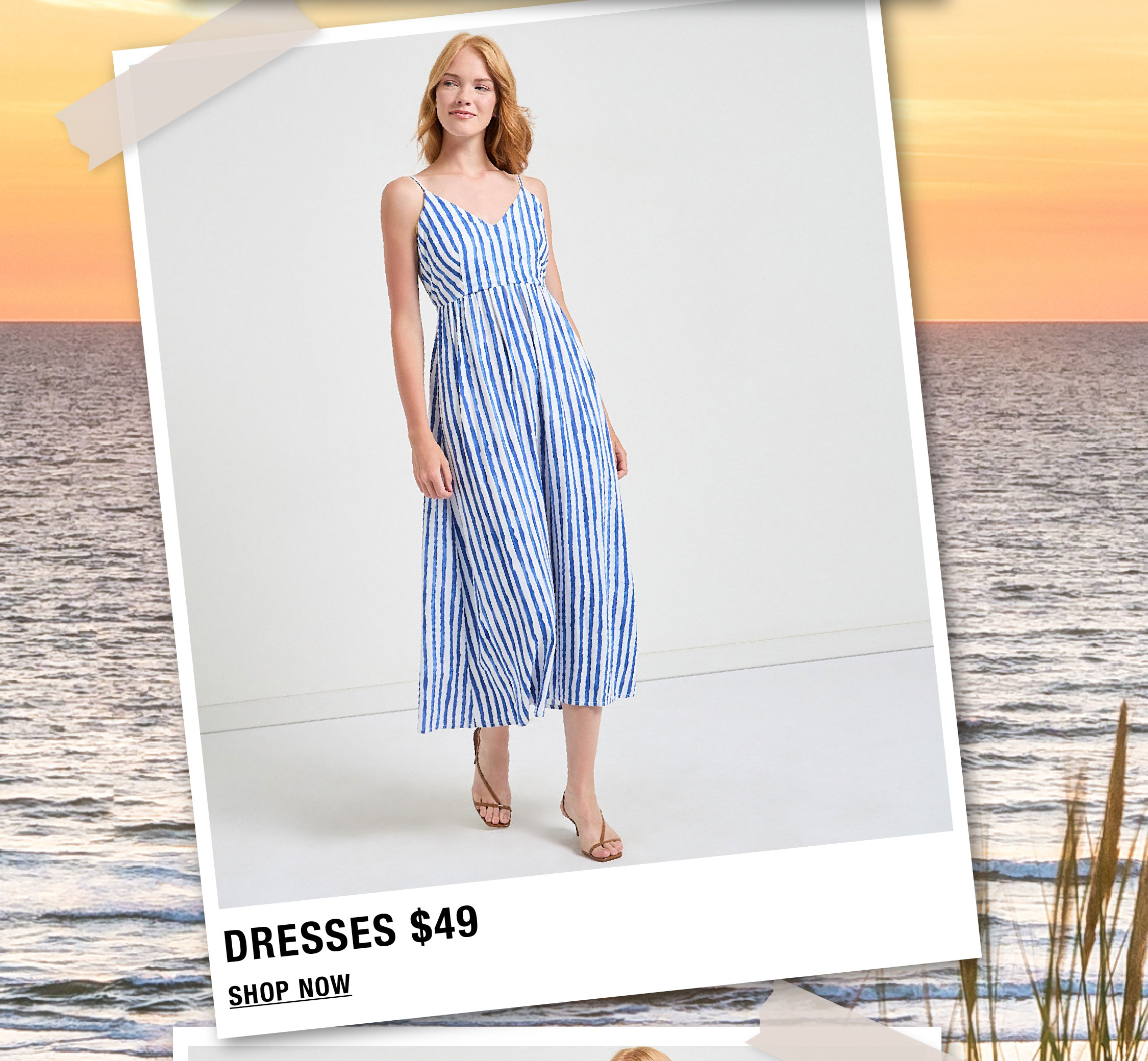 Woman in a blue striped dress with a beach background.