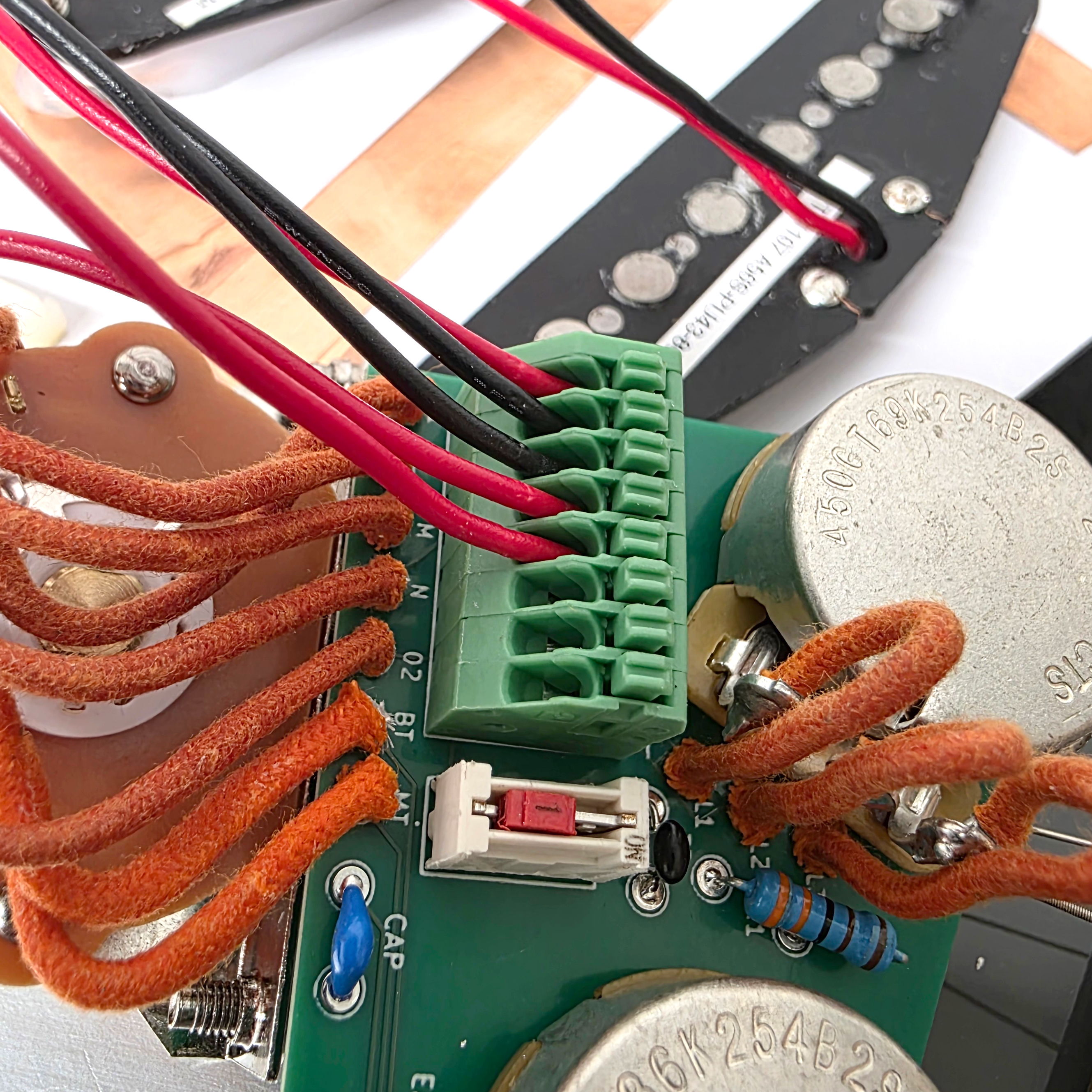 Close-up of a circuit board with wires and components.