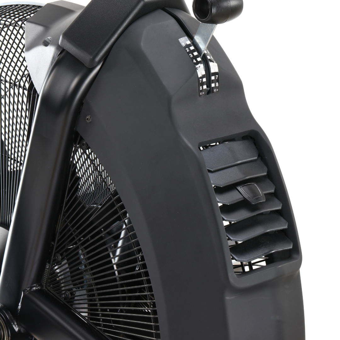 Close-up of a black fan section on an exercise bike.