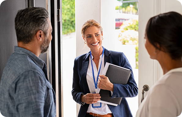 property manager standing at door with clients