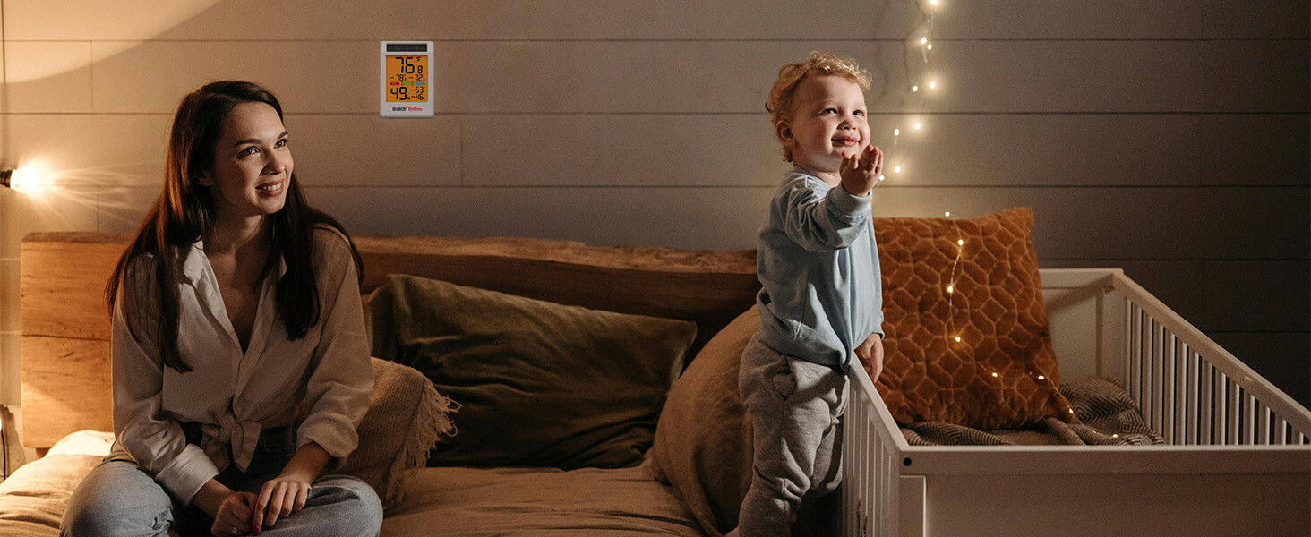 A woman and a child playing in a cozy living room.