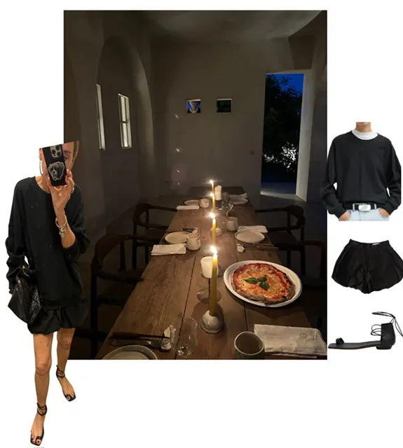 Dining setting with candles, a pizza, and fashion items displayed.