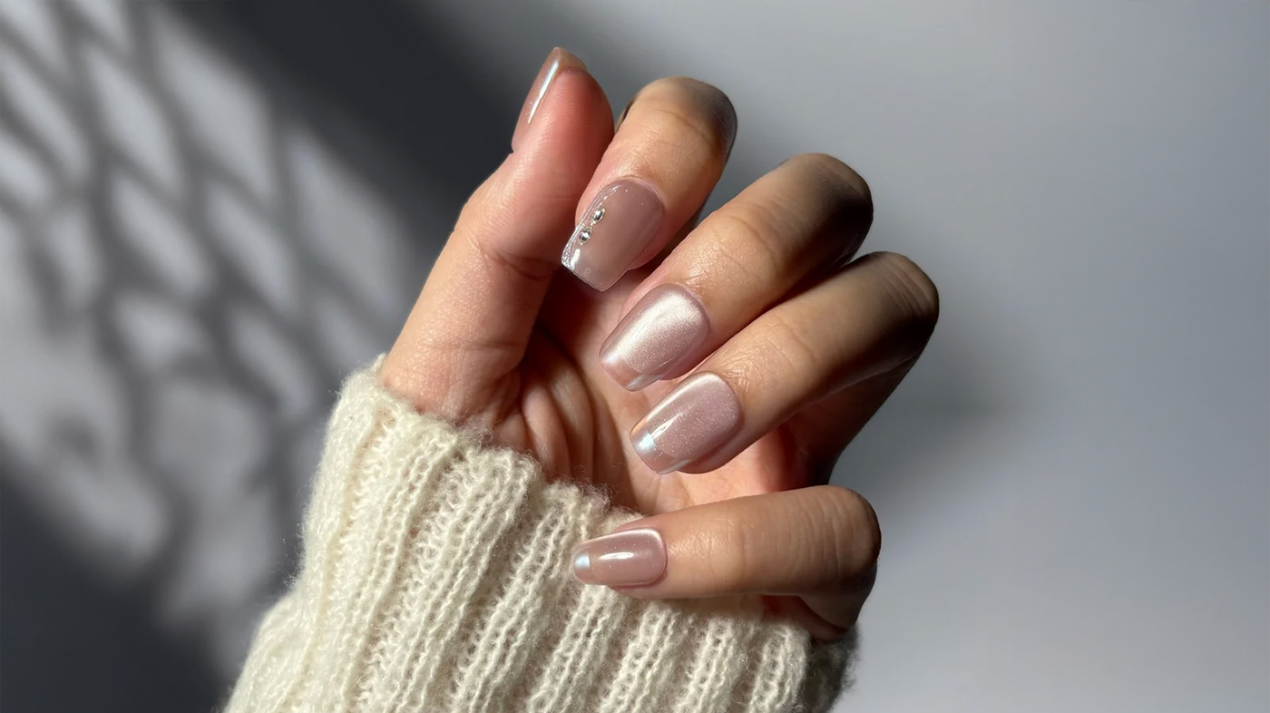 press-on nails applied to healthy natural nails — EyeCandys press-on nails in a neutral shade