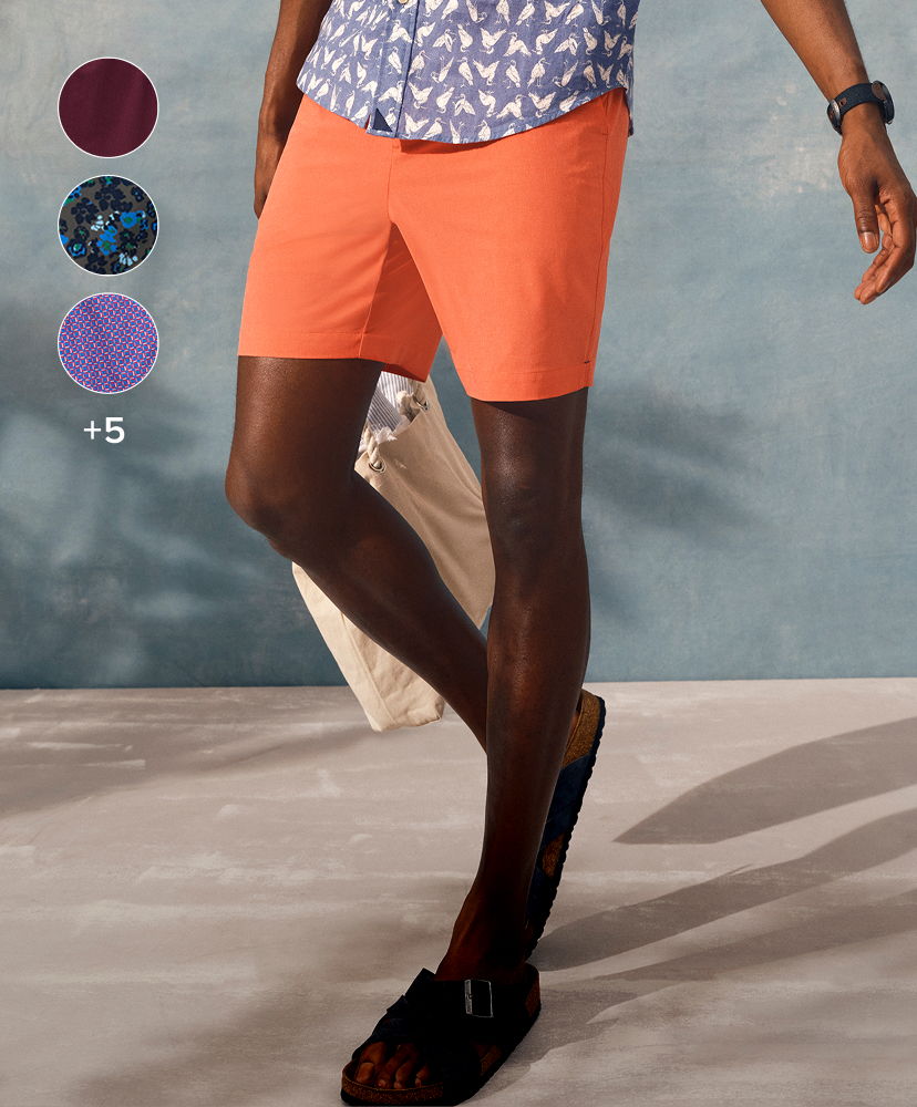 Person wearing orange shorts and patterned shirt, with color options displayed.