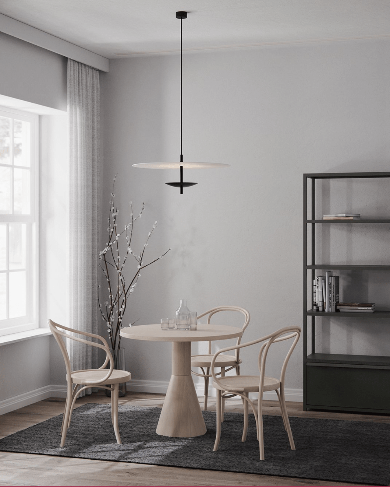 Large Reflector Round Pendant lighting hanging above minimalist dining interior
