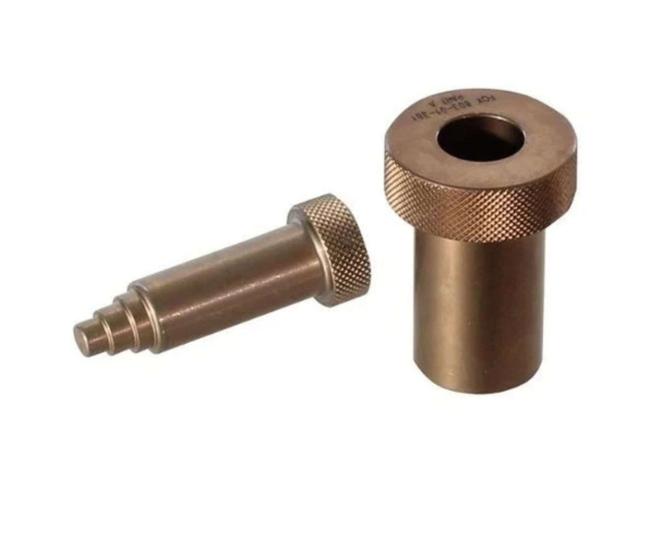 Two brass mechanical components, one cylindrical and one tapered.