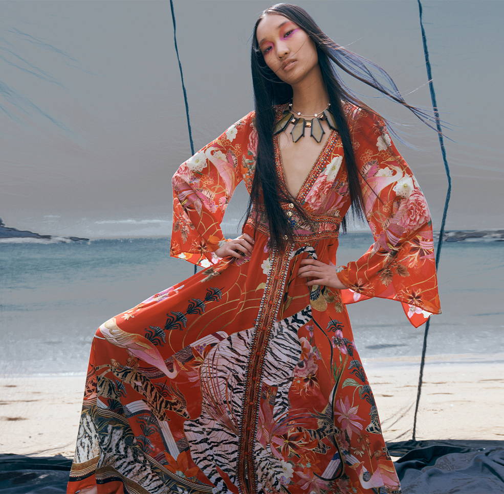 Model wearing new season CAMILLA red longsleeve maxi dress in Legends of Ziba print