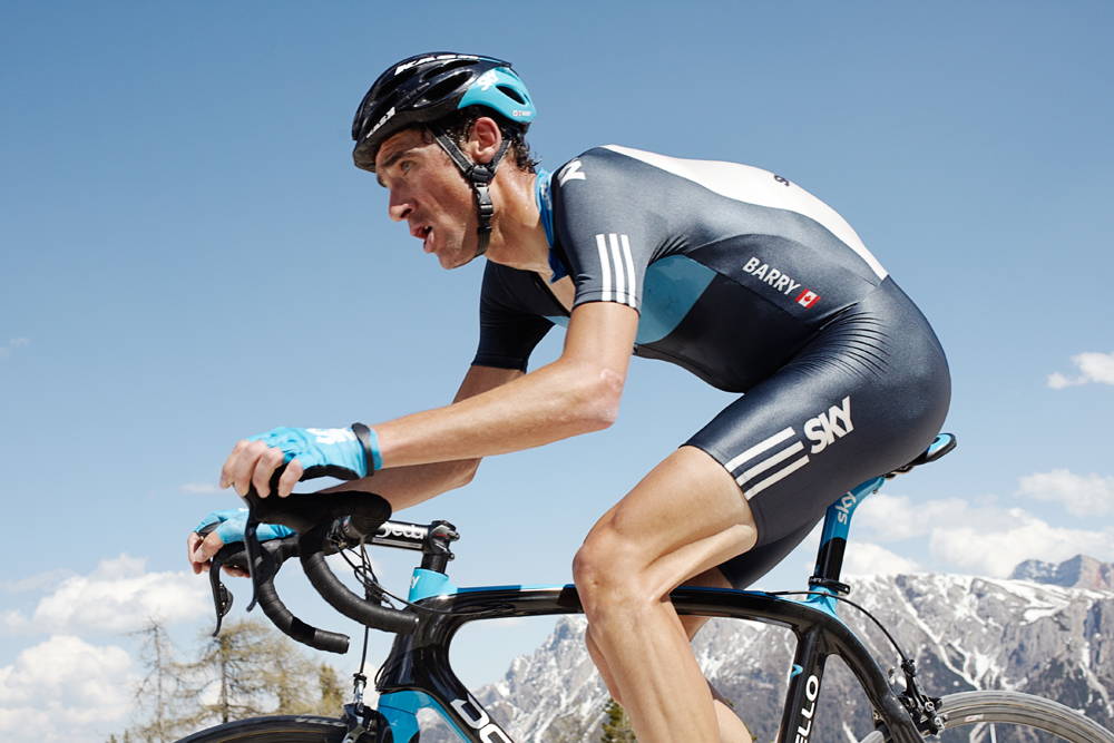 Michael Barry on his bike with mountains in the background