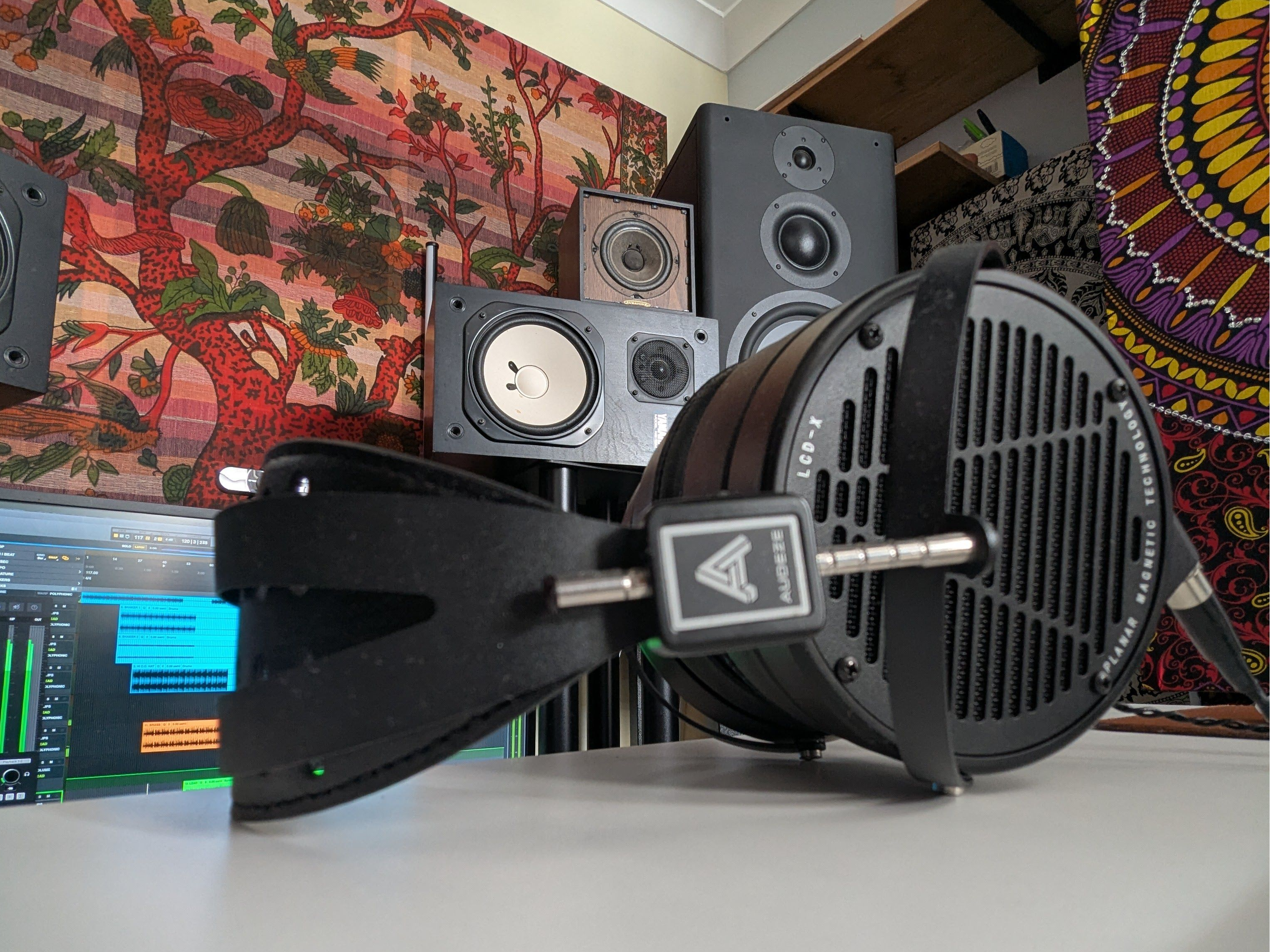 A Closeup of a LCD-X near some speakers