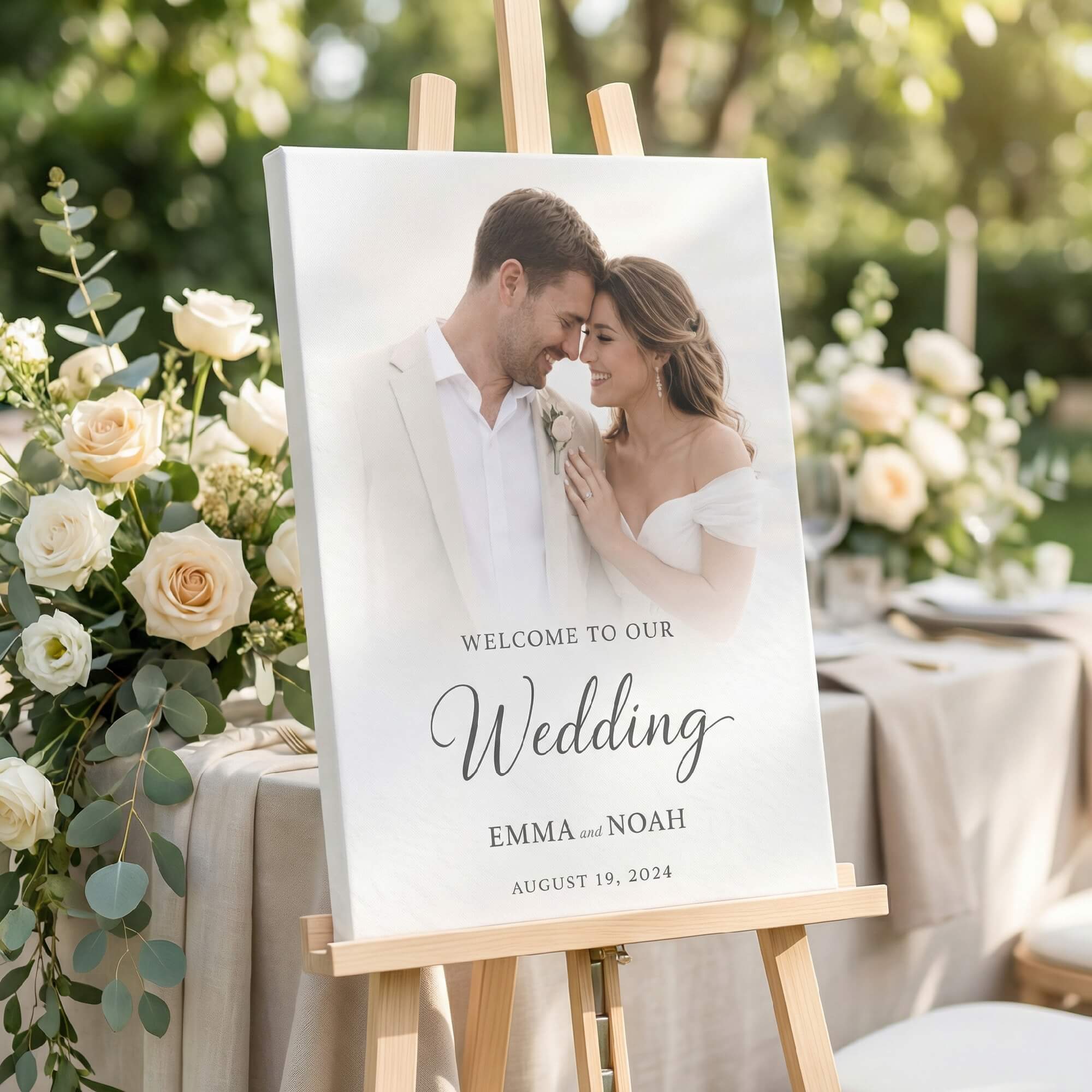 Welcome sign for Emma and Noah's wedding, surrounded by flowers and decor.