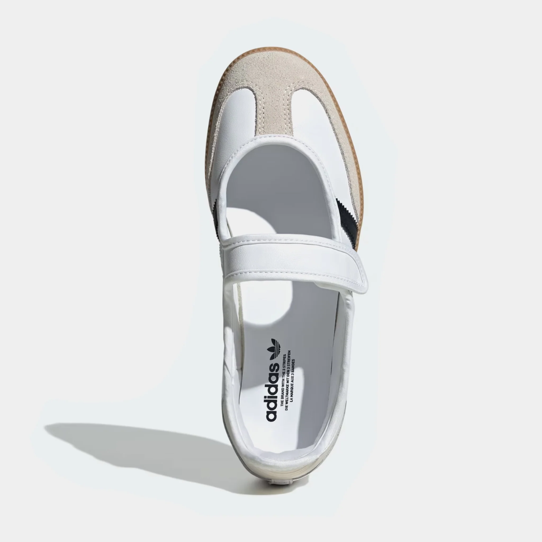 White athletic shoe with black stripes and a Velcro strap.