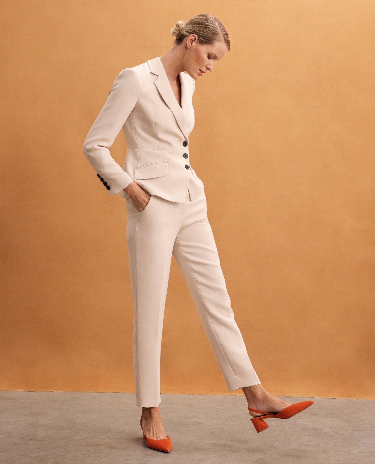 Model wearing stone crepe suiting